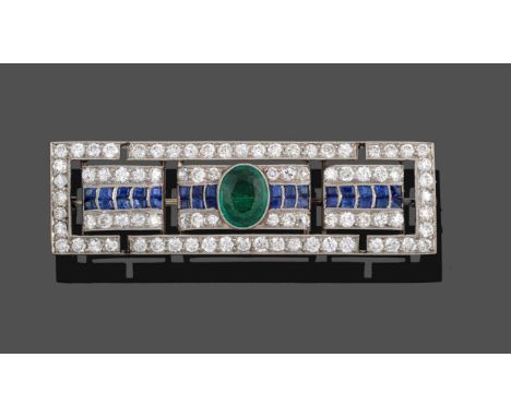 An Art Deco Diamond, Sapphire and Emerald Brooch, the oblong panel formed of three sections to an outer border, an oval cut e