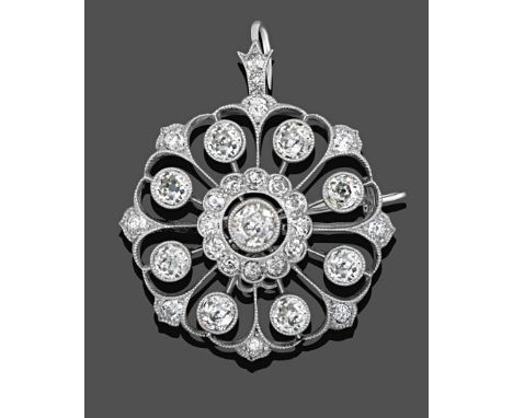 A Diamond Brooch/Pendant, circa 1910, an old cut diamond centrally within a border of smaller old cut diamonds, to eight radi