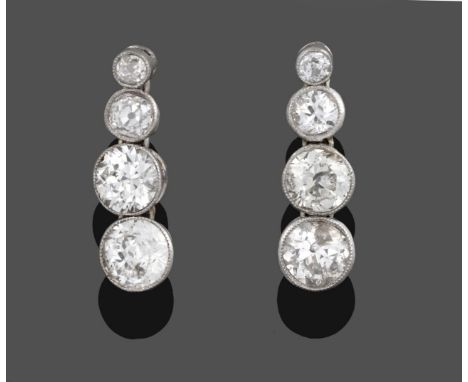 A Pair of Diamond Drop Earrings, four graduated old cut diamonds in white millegrain settings, total estimated diamond weight