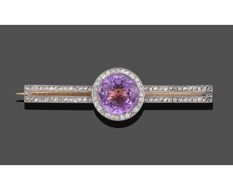 A Diamond and Pinkish-Purple Stone Bar Brooch, the round cut pinkish-purple stone within a border of old cut diamonds, to two