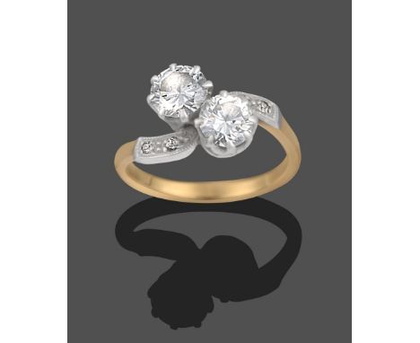 A Diamond Two Stone Twist Ring, the two round brilliant cut diamonds to eight-cut diamond set shoulders in white claw setting