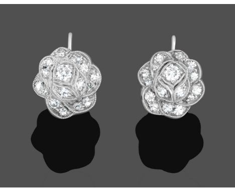 A Pair of Diamond Cluster Earrings, the floral motifs set with brilliant cut and eight-cut diamonds in white millegrain setti