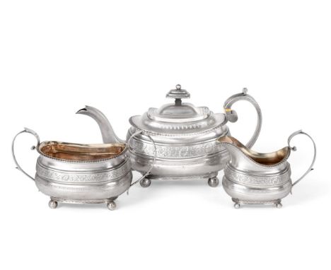 A Three-Piece George III Silver Tea-Service, by William Welch, Exeter, 1813, each piece oblong and on ball feet, engraved wit