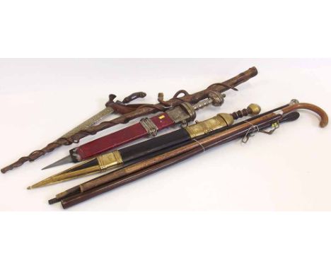 Kris dagger, bandsman's baton, mahogany cleaning rod, wood cosh, three walking sticks, also two Roman design swords. Conditio