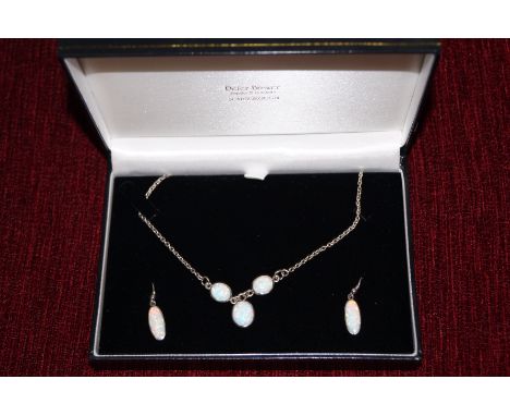 Opal necklace with matching earrings set in silver