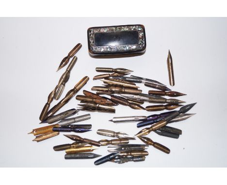 Paper mache snuff box together with a collection of pen nibs