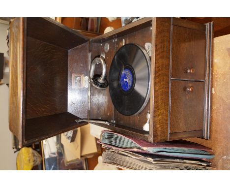 HMV oak cased gramophone, with a quantity of 78's