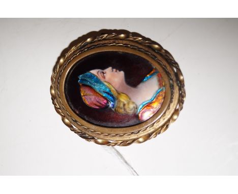 A Limoges enamel and copper brooch