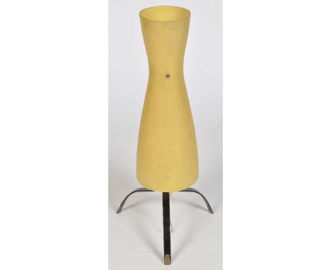 A mid 20th Century floor lamp, with waisted circular plastic shade with three-legged metal stand.
