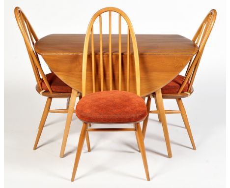 Ercol: a light elm and beech wood drop-leaf dining table, 113 x 72cms high; and three Quaker style dining chairs.