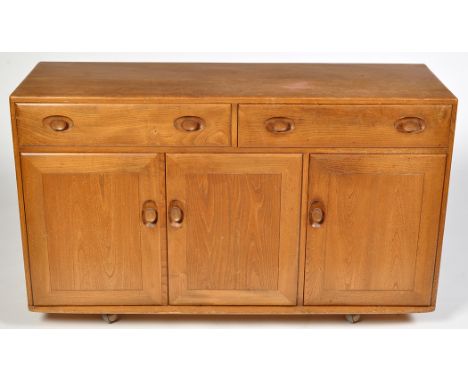 Ercol: a light elm sideboard, with rectangular top above two drawers, above a two-door large cupboard, with adjustable shelf 