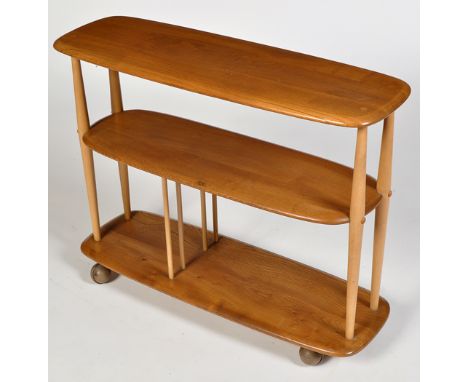 Ercol: a light elm and beech trolley bookcase, mounted on ball castors, 91 x 31 x 72cms high.