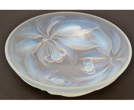 G. Vallon, Paris, France: an opalescent glass fruit bowl, in the style of Lalique, decorated with raised fruit and leaf desig