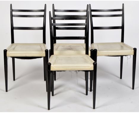 E. Gomme G-Plan: four ebonised ladder back dining chairs.