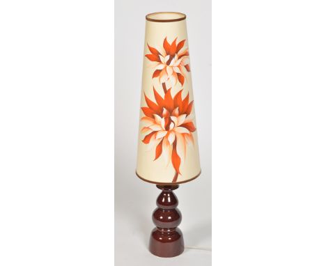 A mid 20th Century pottery table lamp, probably West German with tall tapered circular floral shade, 102cms high.