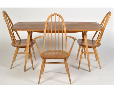 Ercol: a light elm and beech wood dining table, the shaped rectangular dining table on splayed square tapering legs, 152 x 77