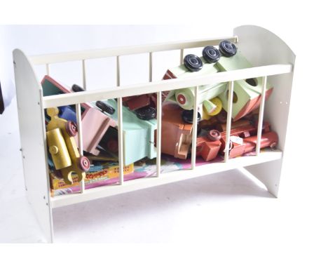 A wooden doll's cot and various toys,  cream painted with sliding side --65cm long; a Sooty Xylophone boxed; a repainted wood