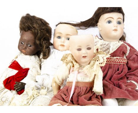 Four reproduction dolls, a Tete Jumeau and K &amp; R 117 on stuffed home-made bodies; an S.F.B.J black 252 on composition bod