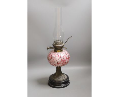A 19th century mottled glass oil lamp, 55cm total height