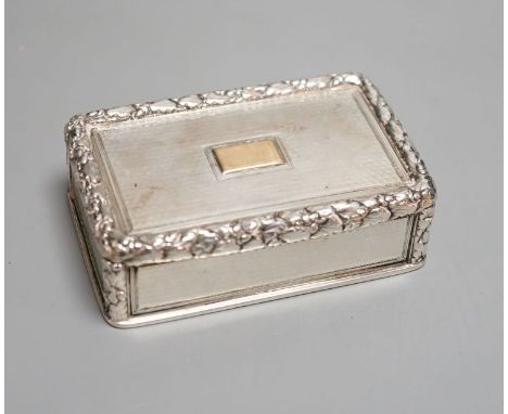 A George IV engine turned silver rectangular snuff box, with yellow metal applique, Charles Rawlings, London, 1827, 82mm.