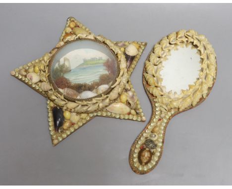 A shell mounted star with central scenic seascape and a shell hand mirror, star 24 cms wide.
