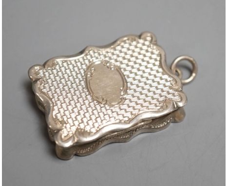 A Victorian engine turned silver shaped rectangular vinaigrette, Frederick Marson, Birmingham, 1875, 32mm.