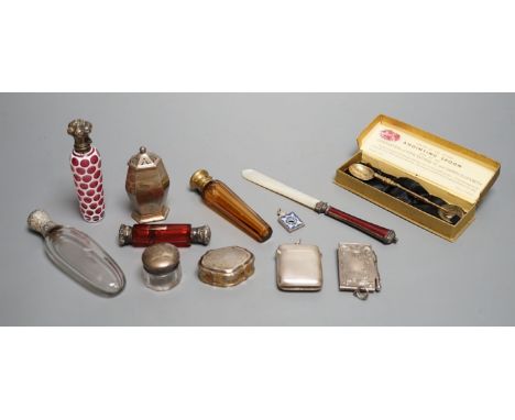 Four assorted white of gilt metal mounted glass scent bottles, largest 12.2cm, an unusual gilt white metal snuff box?, with s