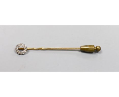 An Edwardian yellow metal and diamond cluster set stick pin, 58mm, gross 1.4 grams.