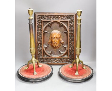 A late 19th century Continental heavily carved walnut and boxwood panel of Christ, a pair of brass lamp bases and two circula