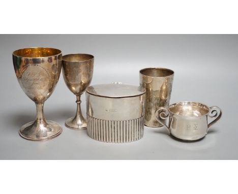 A George III engraved silver goblet, maker's mark rubbed, London, 1784, 14.6cm, together with an Edwardian silver tea caddy, 