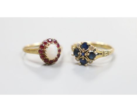 A modern 14ct gold, sapphire and diamond set cluster ring, size L, gross 3.2 grams and a 9ct gold opal and ruby cluster ring,