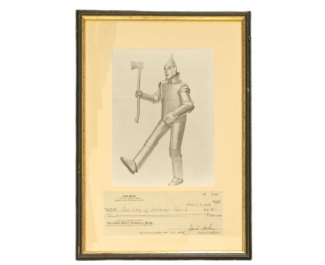 Jack Haley signed cheque dated 1968 with a black and white photo as Tinman from The Wizard of OZ, framed measures 17 inch by 