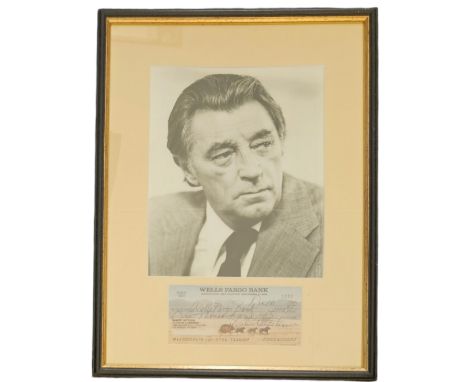 Robert Mitchum signed cheque dated 1995 with black and white photo, framed measures 12 inch by 16-inch appx. Good condition E