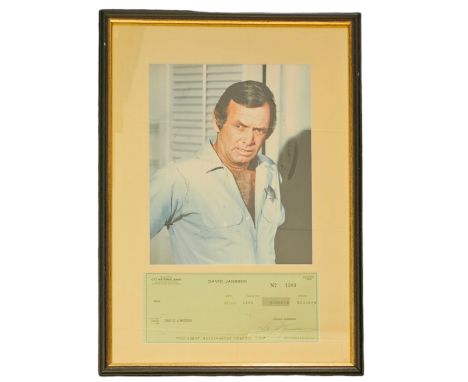 David Janssen signed cheque dated 1973 with colour photo, framed measures 12 inch by 16-inch appx. Good condition Est. Good c