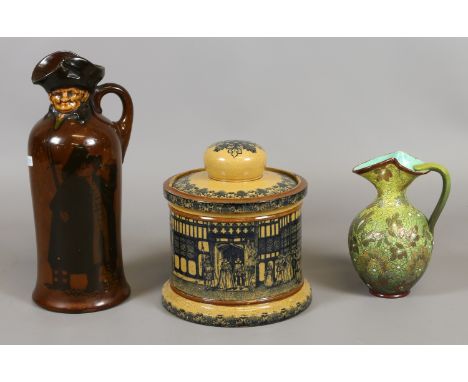 A Royal Doulton Kingsware whiskey flagon, Old Moreton tobacco jar and cover and a Doulton Lambeth moulded ewer. Condition Rep