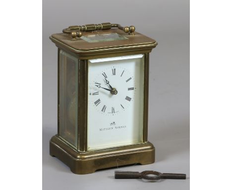 A brass carriage clock by Matthew Norman Switzerland.