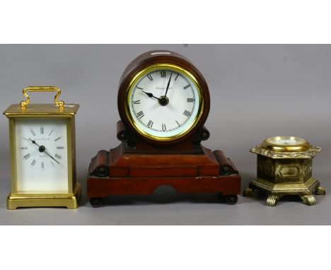 Three quartz clocks including a walnut drum head mantel clock and a carriage clock.
