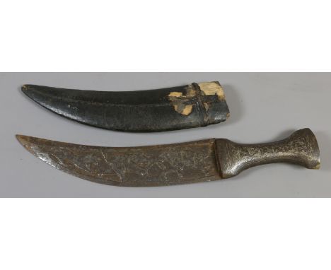 A C19th Persian dagger in leather mounted wooden sheath with niello work hilt and carved blade decorated in relief with anima