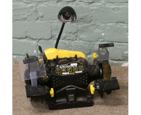 A 230 volt 150mm bench grinder model No. CLM150BG with fitted work light.