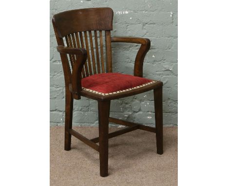 An oak stick back office armchair.