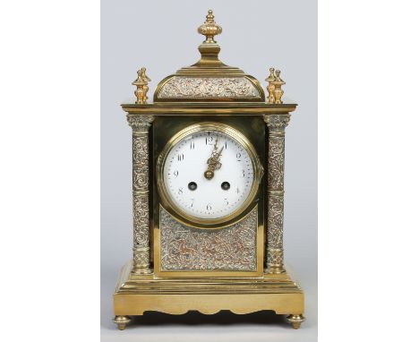 A 19th century French gilt brass mantel clock. With pagoda top and copper plated corinthian column supports. With enamel dial