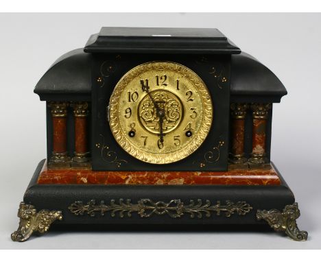 A Victorian Ingraham eight day mantle clock with pilaster columns and ebonized case