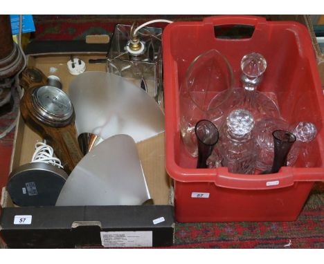 Two boxes containing assorted glassware including decanters, oak wall barometer and lamps etc.