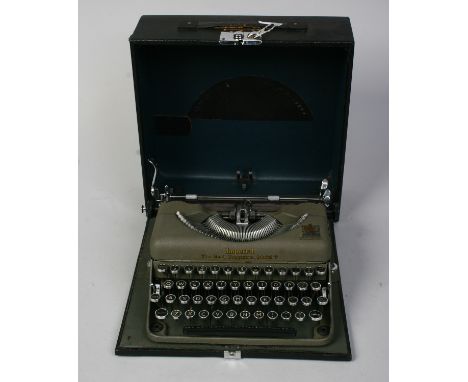 An Imperial model T. Good companion typewriter in case.