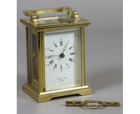 A brass cased carriage clock with enamel dial, signed Bernard Freres Bicester.