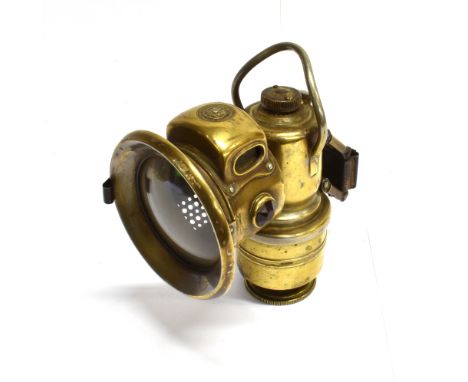 A POWELL &amp; HANMER 'NEW 75' CARBIDE MOTORCYCLE LAMP  19cm high of standard production pattern, brass lacking nickel plate,
