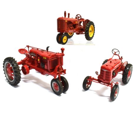 A DIE-CAST SCALE MODEL OF A 1946 MCCORMICK FARMALL TRACTOR BY FRANKLIN MINT PRECISION MODELS  finished in red with rubber tyr