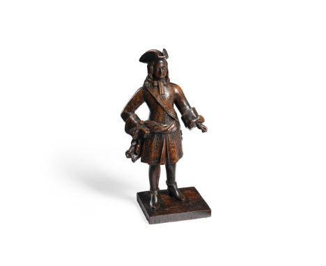 A RARE CARVED OAK MODEL OF A EUROPEAN MERCHANT OR ARMY OFFICER 18TH CENTURY, DUTCH OR POSSIBLY FRENCH In contemporary attire 