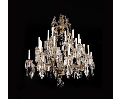 A LARGE ITALIAN CUT-GLASS AND GILT IRON TWENTY EIGHT-LIGHT CHANDELIER PIEDMONTESE, MID 18TH CENTURY AND LATER With twenty eig
