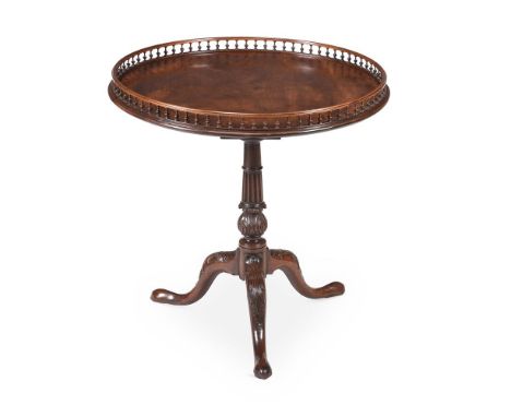 A GEORGE III MAHOGANY GALLERIED TRIPOD TABLELATE 18TH CENTURYThe revolving tilt top on a birdcage support77cm high, 76cm diam